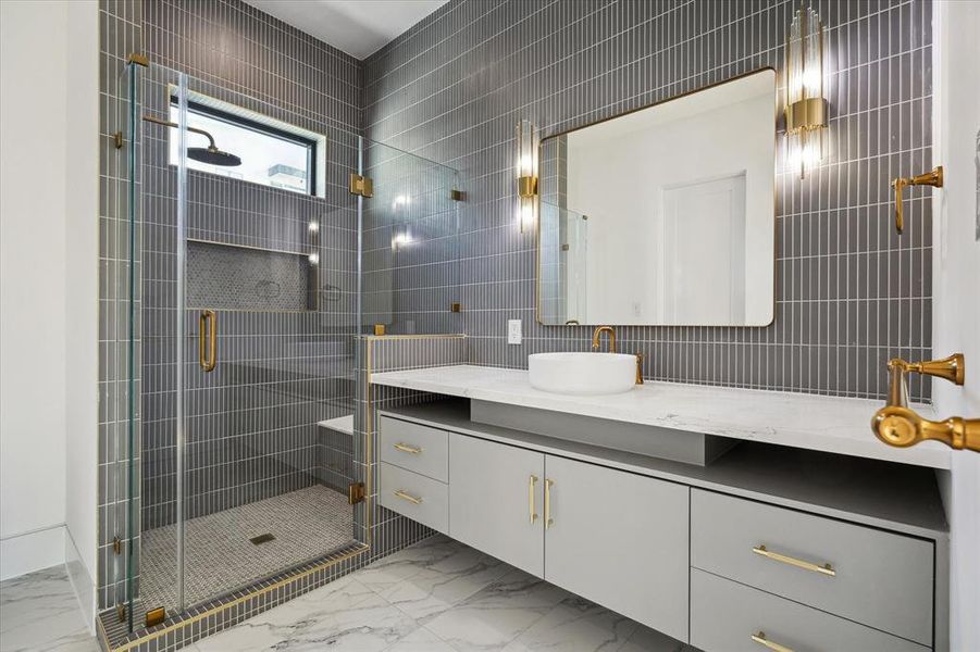 Secondary Bathroom 2 with floating vanity, glass enclosed shower and fitted walk-in closet