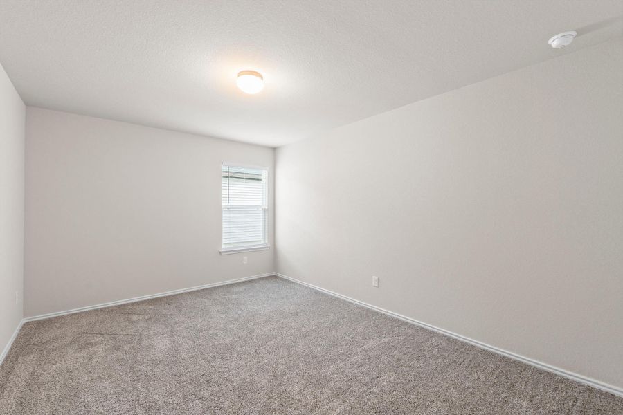 Located completely separate from the primary suite, these guest bedrooms sit right off the front foyer Located completely separate from the primary suite, these guest bedrooms sit right off the front foyer