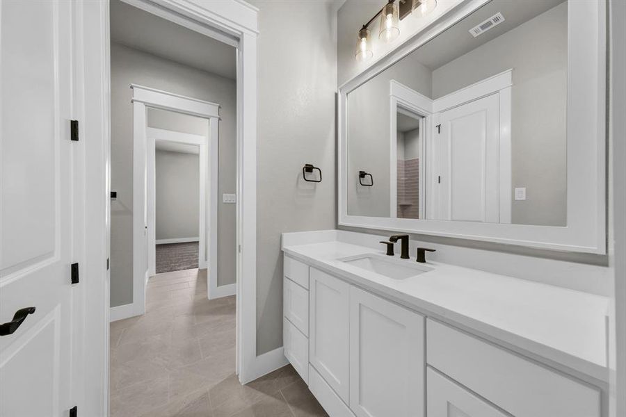 Jack and Jill Bathroom with vanity and tile floors