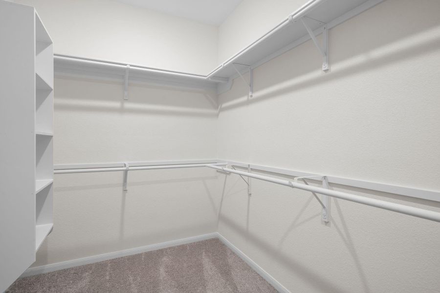 A view of your large primary walk-in Closet