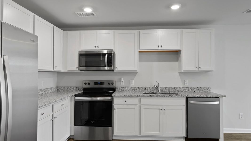 Representative furnished interior of a home built from the SULLIVAN by D.R. Horton in Center Pointe, Santee (Image 6).