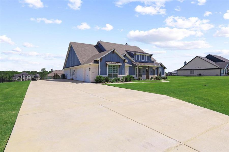 Front exterior of a new home in The Meadows, Gunter, TX, highlighting curb appeal (Image 21). Front exterior of a new home in The Meadows, Gunter, TX, highlighting curb appeal (Image 21).