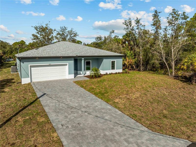Front exterior of a new home in , North Port, FL, highlighting curb appeal (Image 27).