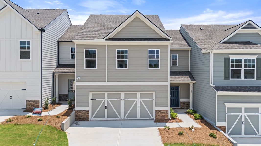 Front exterior of a new home in The Retreat at Browns Ridge, Newnan, GA, highlighting curb appeal (Image 1). Front exterior of a new home in The Retreat at Browns Ridge, Newnan, GA, highlighting curb appeal (Image 1).
