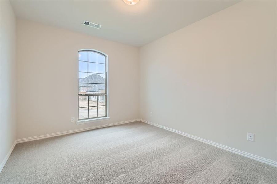 Unfurnished room featuring carpet