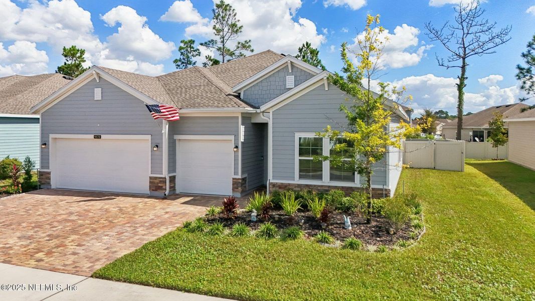 Front exterior of a new home in Longleaf: Longleaf 60s, Jacksonville, FL, highlighting curb appeal (Image 1).