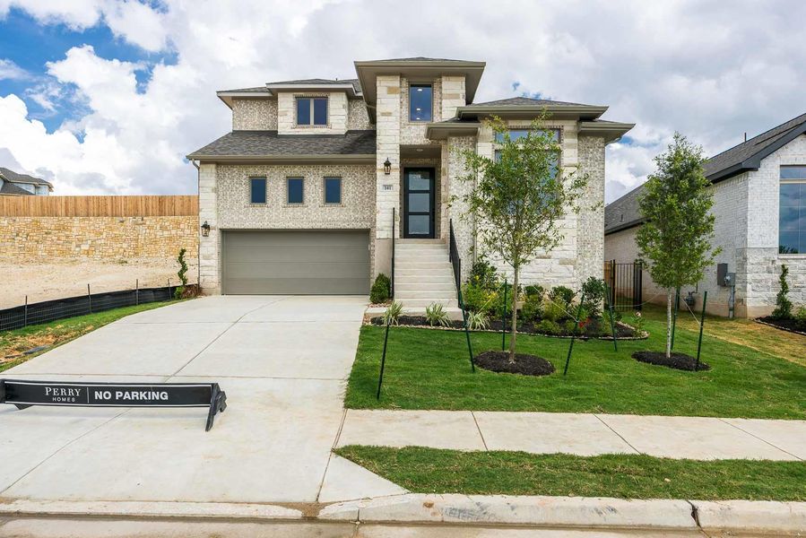 Front exterior of a new home in Santa Rita Ranch - Eldorado, Liberty Hill, TX, highlighting curb appeal (Image 2). Front exterior of a new home in Santa Rita Ranch - Eldorado, Liberty Hill, TX, highlighting curb appeal (Image 2).