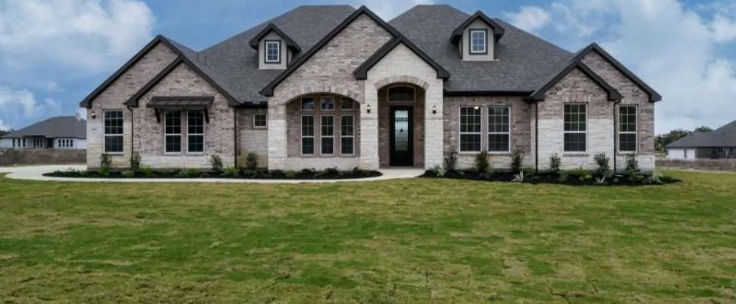Representative exterior photo of a completed home built from the Kylie by Ashton Woods in Waldsanger, New Braunfels, TX (Image 19). Representative exterior photo of a completed home built from the Kylie by Ashton Woods in Waldsanger, New Braunfels, TX (Image 19).