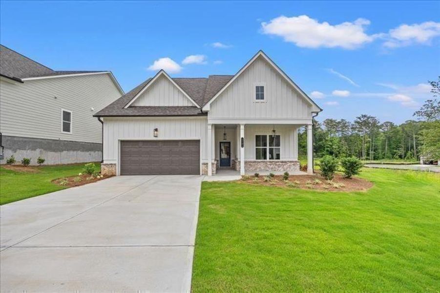 Front exterior of a new home in Cooks Farm, Woodstock, GA, highlighting curb appeal (Image 34). Front exterior of a new home in Cooks Farm, Woodstock, GA, highlighting curb appeal (Image 34).