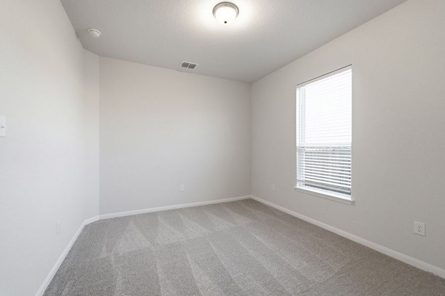 Spacious, unfurnished interior of a new home in The Woodlands at Medina Hills, Mico (Image 18).