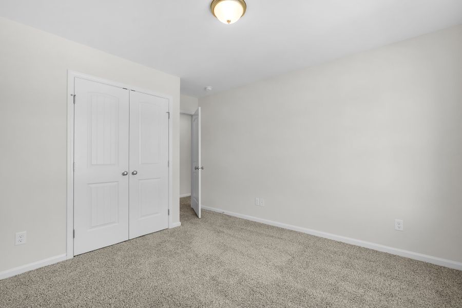 Representative unfurnished interior of a home built from the The Magnolia by Smith Family Homes in Lakeview Pines, Statesboro (Image 55).