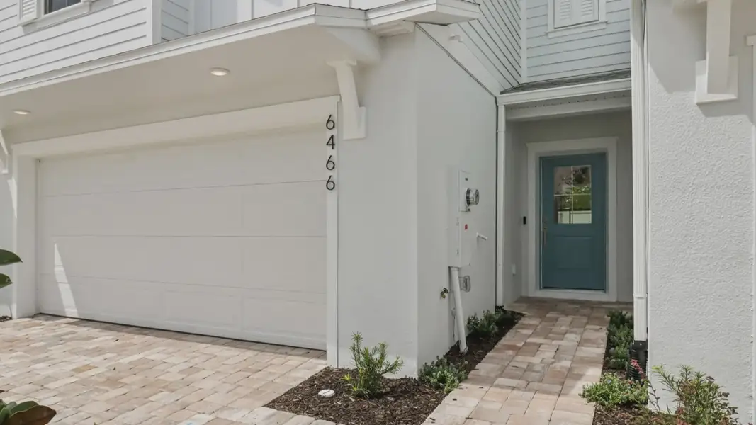 Exterior details and patio area of a home in Cyrene at Harmony, St. Cloud (Image 3).