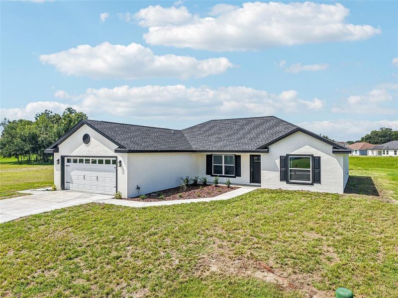 Front exterior of a new home in , Bushnell, FL, highlighting curb appeal (Image 29).