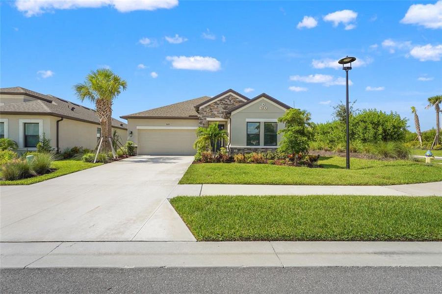 Front exterior of a new home in , Nokomis, FL, highlighting curb appeal (Image 26). Front exterior of a new home in , Nokomis, FL, highlighting curb appeal (Image 26).