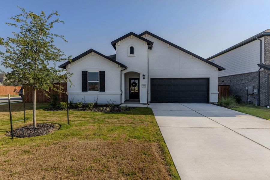 Front exterior of a new home in Lisso, Pflugerville, TX, highlighting curb appeal (Image 1). Front exterior of a new home in Lisso, Pflugerville, TX, highlighting curb appeal (Image 1).
