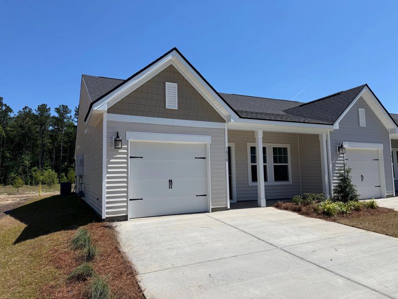 Front exterior of a new home in Hammock Walk at Nexton, Summerville, SC, highlighting curb appeal (Image 11). Front exterior of a new home in Hammock Walk at Nexton, Summerville, SC, highlighting curb appeal (Image 11).
