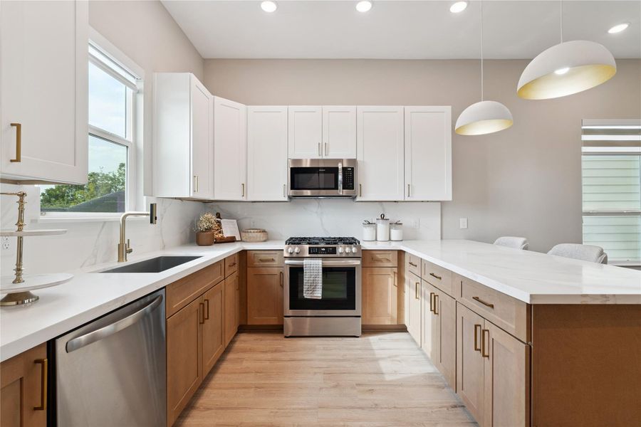 Minimalist lines frame this culinary core, where natural light meets refined utility and subtle elevation.