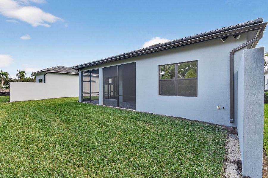 Exterior details and patio area of a home in Greyhawk Landing, Lake Worth (Image 26).