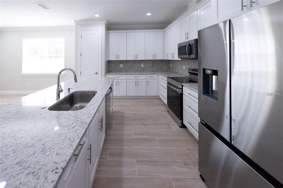 Furnished interior view inside a new home in , Summerfield (Image 10).