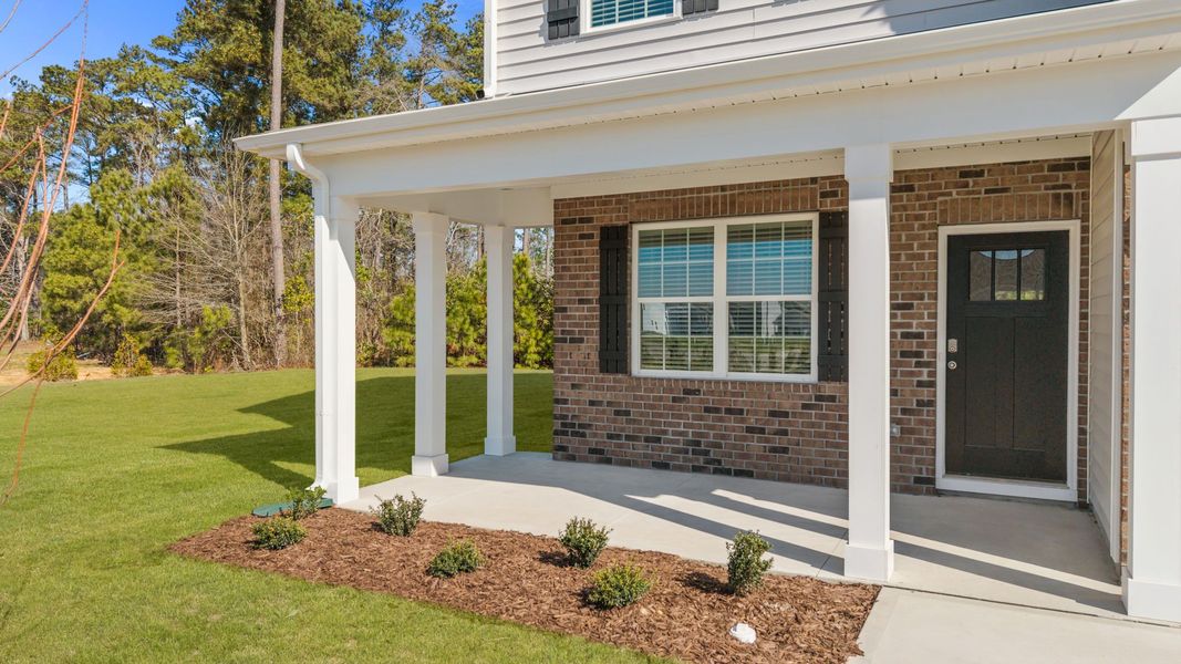 Exterior details and patio area of a home in Ridgewood Farms, Winterville (Image 3).