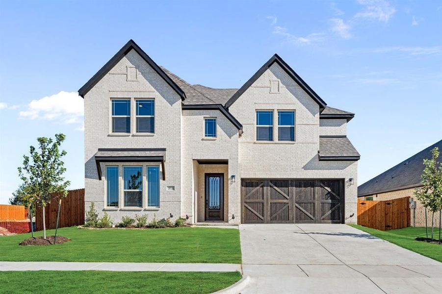 Front exterior of a new home in The Retreat at North Grove 60, Waxahachie, TX, highlighting curb appeal (Image 2).