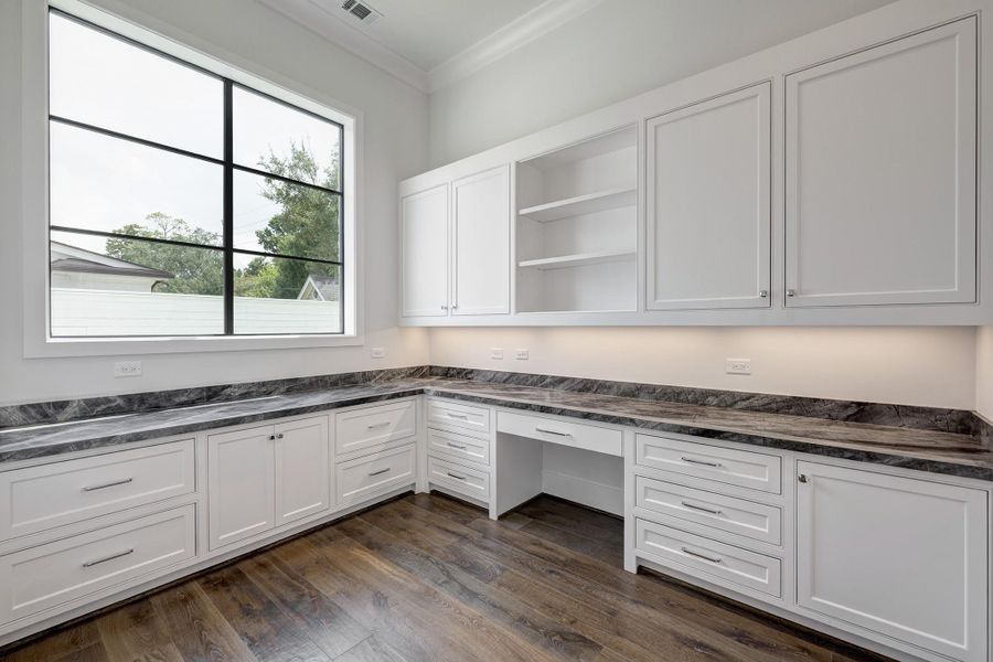 1st floor office with lots of built-ins and large window is great for a work-from-home or study space.