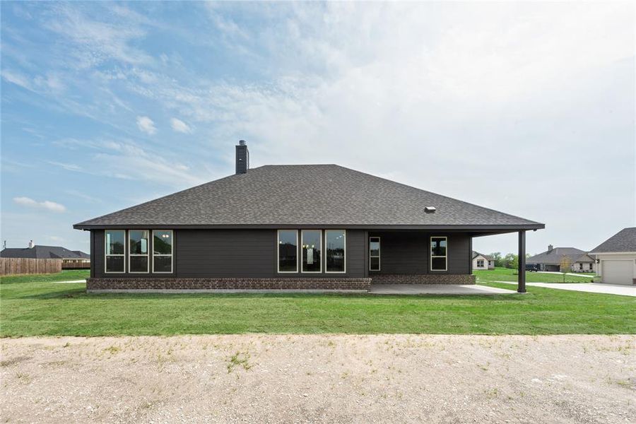 Front exterior of a new home in Nash Estates, Tom Bean, TX, highlighting curb appeal (Image 19).