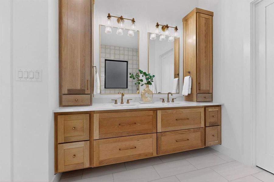 Primary bath with custom cabinetry and finishes create a spa feel.