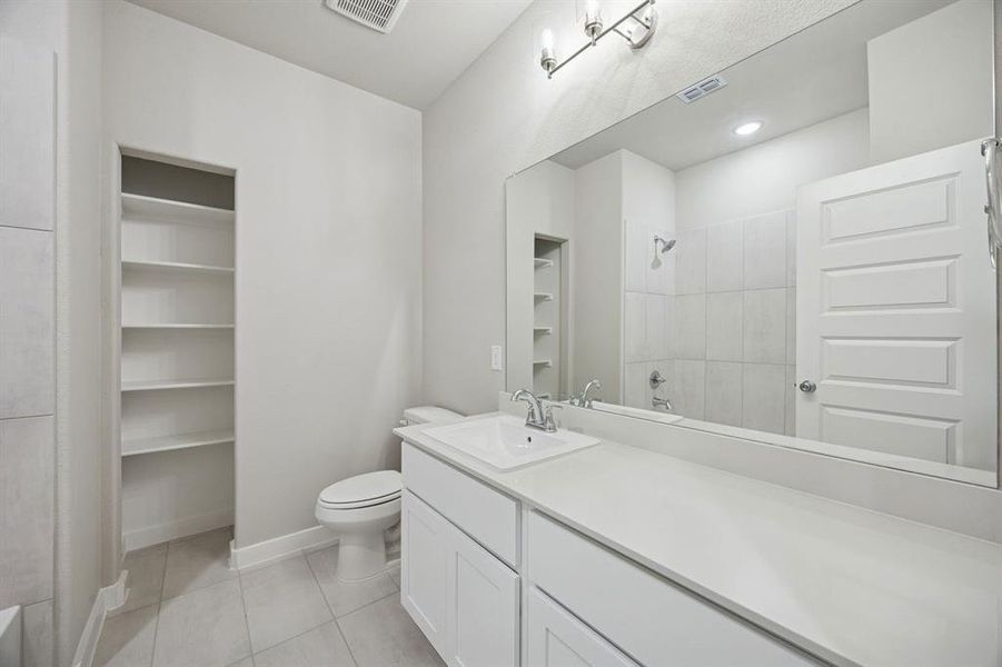 Bathroom in the Stanley II home plan by Trophy Signature Homes – REPRESENTATIVE PHOTO