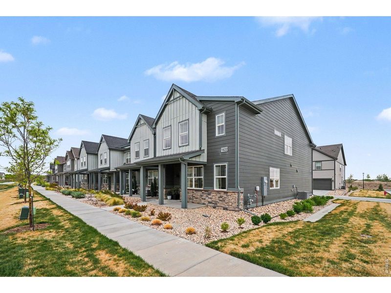 Front exterior of a new home in Poudre Heights: The Meadow Collection, Windsor, CO, highlighting curb appeal (Image 25). Front exterior of a new home in Poudre Heights: The Meadow Collection, Windsor, CO, highlighting curb appeal (Image 25).