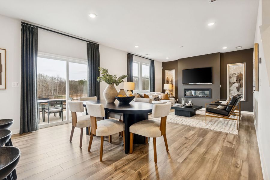 A large living room with a large window. A large living room with a large window.
