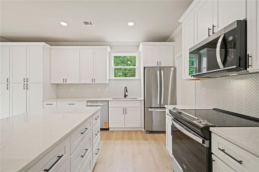Furnished interior view inside a new home in , White (Image 6). Furnished interior view inside a new home in , White (Image 6).