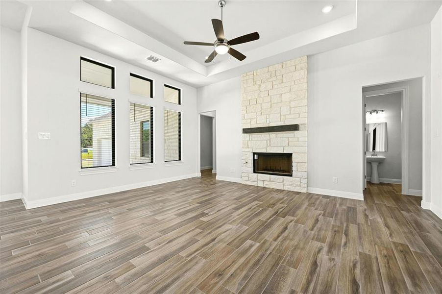 Family room with beautiful stone fireplace.