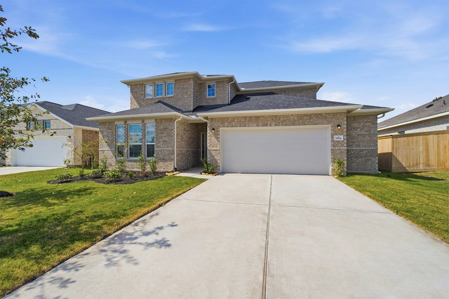 Front exterior of a new home in Ashland, Richwood, TX, highlighting curb appeal (Image 2). Front exterior of a new home in Ashland, Richwood, TX, highlighting curb appeal (Image 2).
