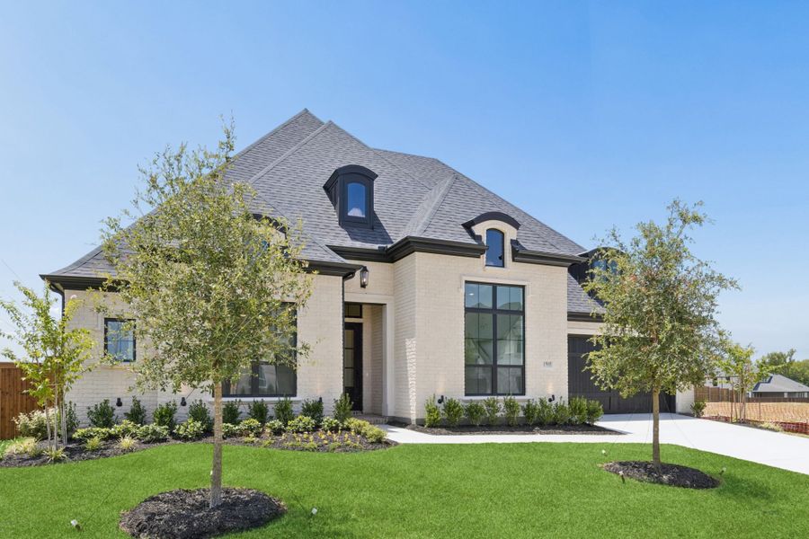 Front exterior of a new home in The Parks at Wilson Creek, Celina, TX, highlighting curb appeal (Image 2). Front exterior of a new home in The Parks at Wilson Creek, Celina, TX, highlighting curb appeal (Image 2).