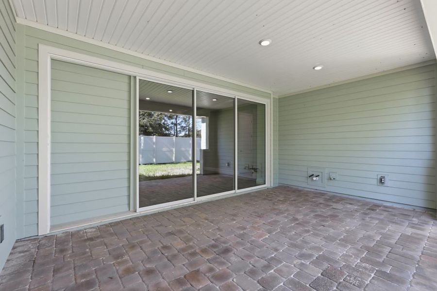 Exterior details and patio area of a home in Headwaters at Lofton Creek, Yulee (Image 2).