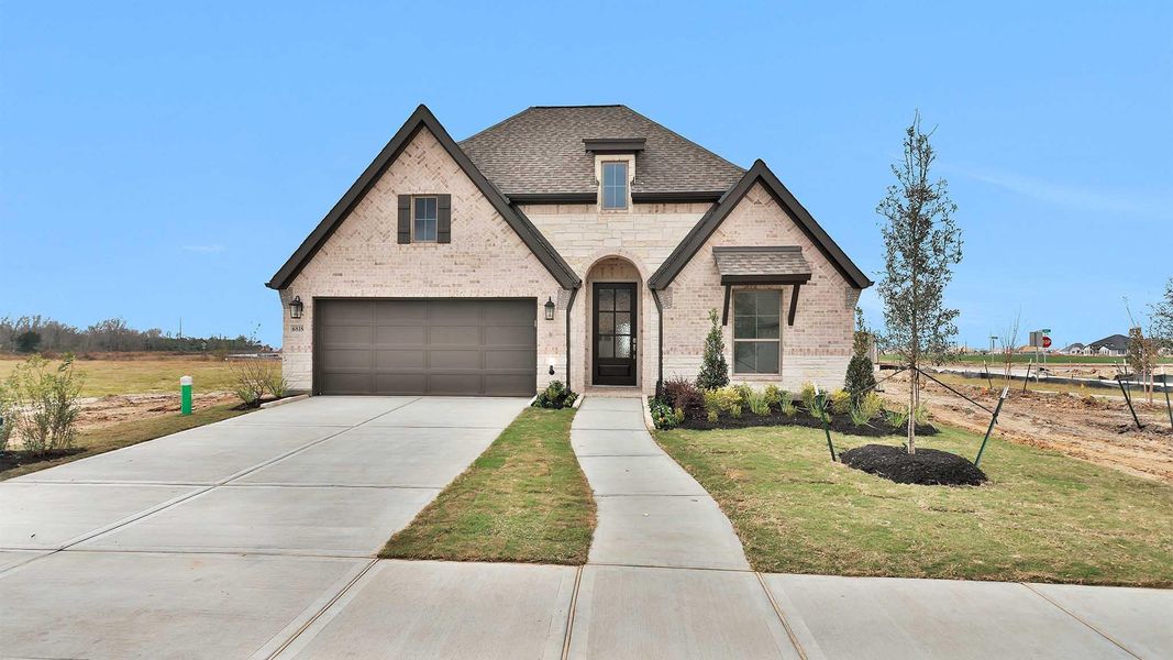 Front exterior of a new home in Legacy 50', League City, TX, highlighting curb appeal (Image 2).