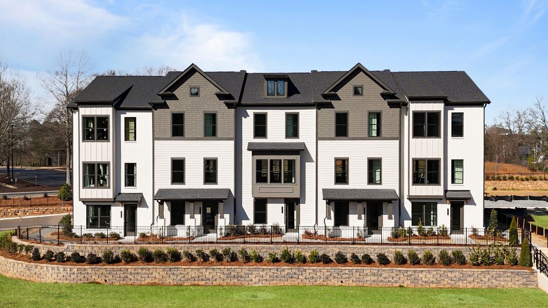 Front exterior of a new home in Barrett Pointe, Kennesaw, GA, highlighting curb appeal (Image 1). Front exterior of a new home in Barrett Pointe, Kennesaw, GA, highlighting curb appeal (Image 1).