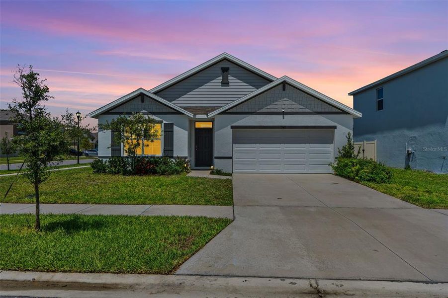 Front exterior of a new home in , Wesley Chapel, FL, highlighting curb appeal (Image 26).