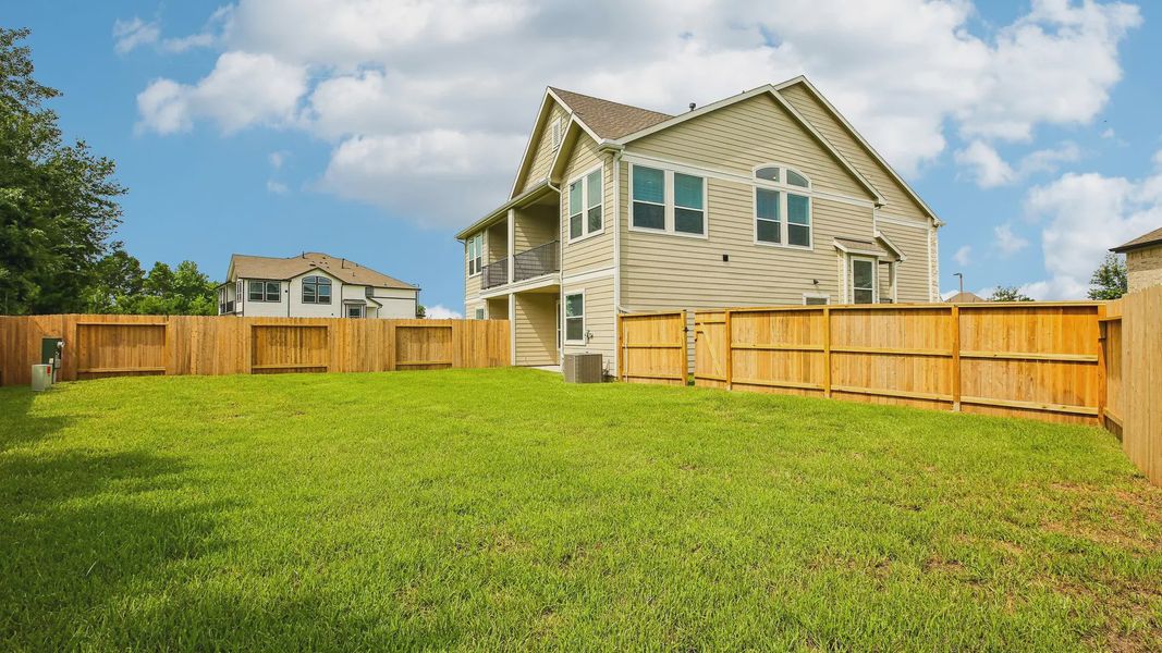 Exterior details and patio area of a home in Woodforest, Montgomery (Image 22).