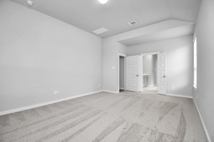 Unwind in style in this remarkable primary suite after a long day! Revel in the luxury of plush carpet, warm paint tones, soaring ceilings, and expansive windows featuring privacy blinds. Sample photo of completed home with similar floor plan. As-built interior colors and selections may vary. Unwind in style in this remarkable primary suite after a long day! Revel in the luxury of plush carpet, warm paint tones, soaring ceilings, and expansive windows featuring privacy blinds. Sample photo of completed home with similar floor plan. As-built interior colors and selections may vary.