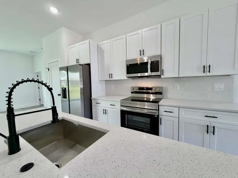 Furnished interior view inside a new home in , Ocala (Image 9).