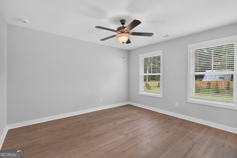 Spacious, unfurnished interior of a new home in The Cottages at East Lanier, Fayetteville (Image 12).