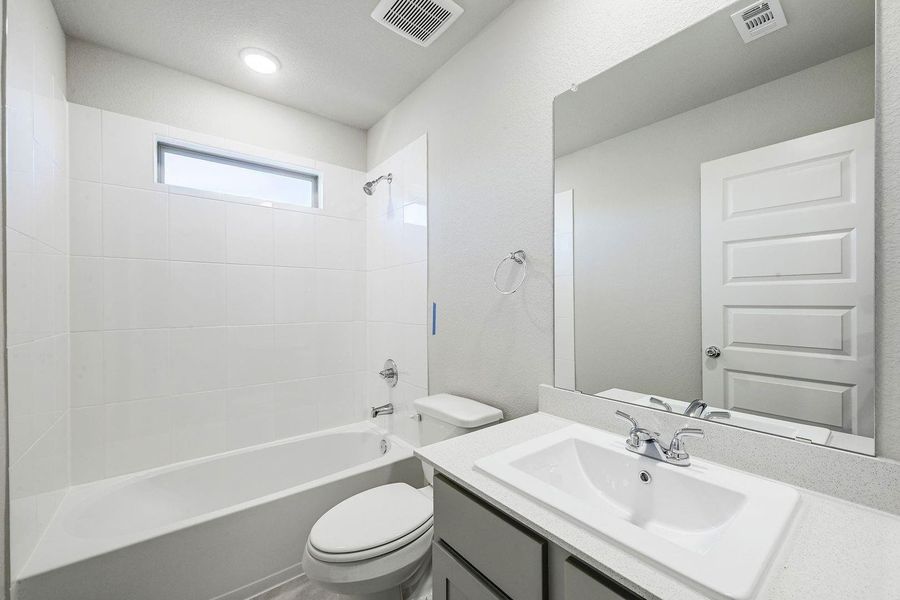 Bathroom in the Willow home plan by Trophy Signature Homes – REPRESENTATIVE PHOTO