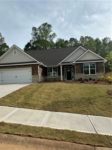 Front exterior of a new home in Mirror Lake at South Harbour, Villa Rica, GA, highlighting curb appeal (Image 1).
