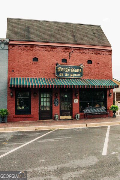 Front exterior of a new home in Rosewood Lake Estates, Hoschton, GA, highlighting curb appeal (Image 61).