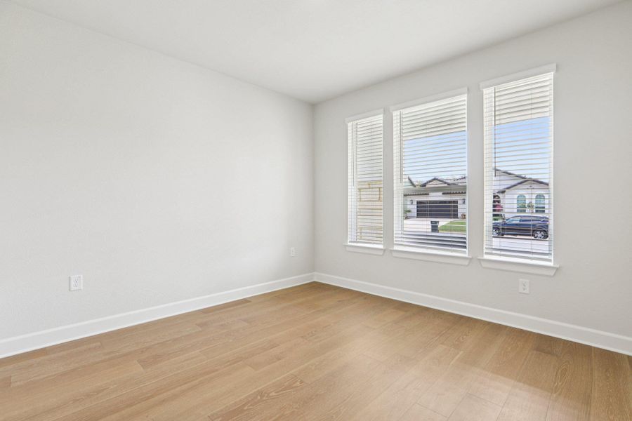 Spare room with light wood finished floors and baseboards