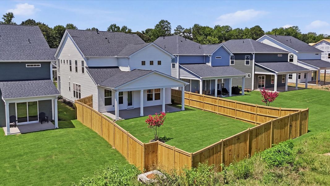 Elegant exterior with a rear covered porch—perfect for relaxing or entertaining outdoors at Harrier Point Elegant exterior with a rear covered porch—perfect for relaxing or entertaining outdoors at Harrier Point