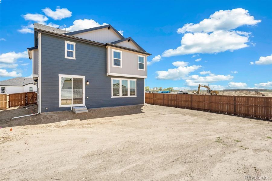 Front exterior of a new home in Farmlore, Brighton, CO, highlighting curb appeal (Image 19).