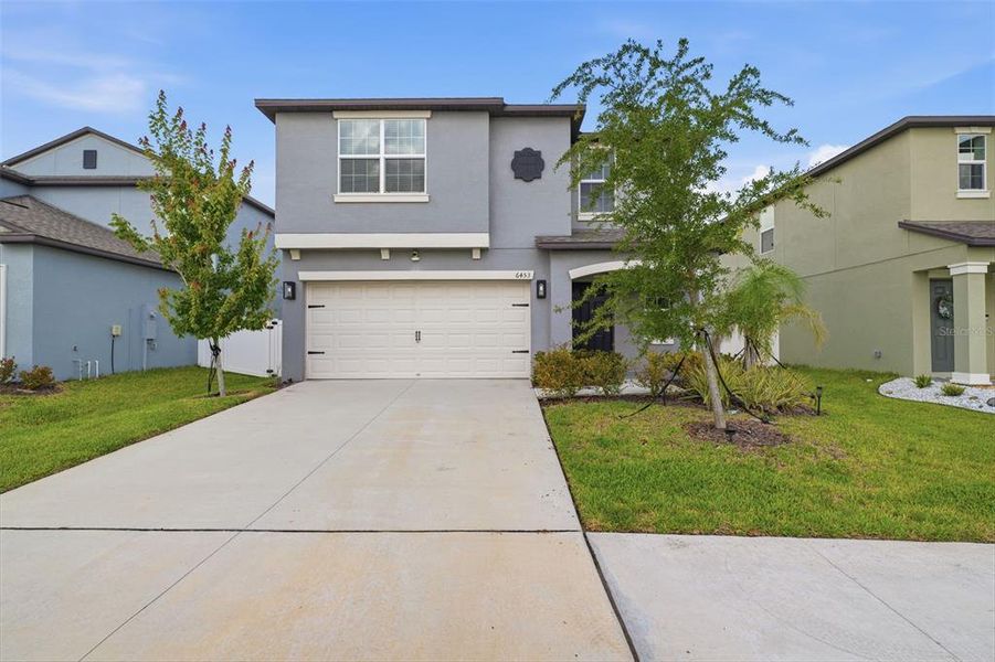 Front exterior of a new home in , Zephyrhills, FL, highlighting curb appeal (Image 28).